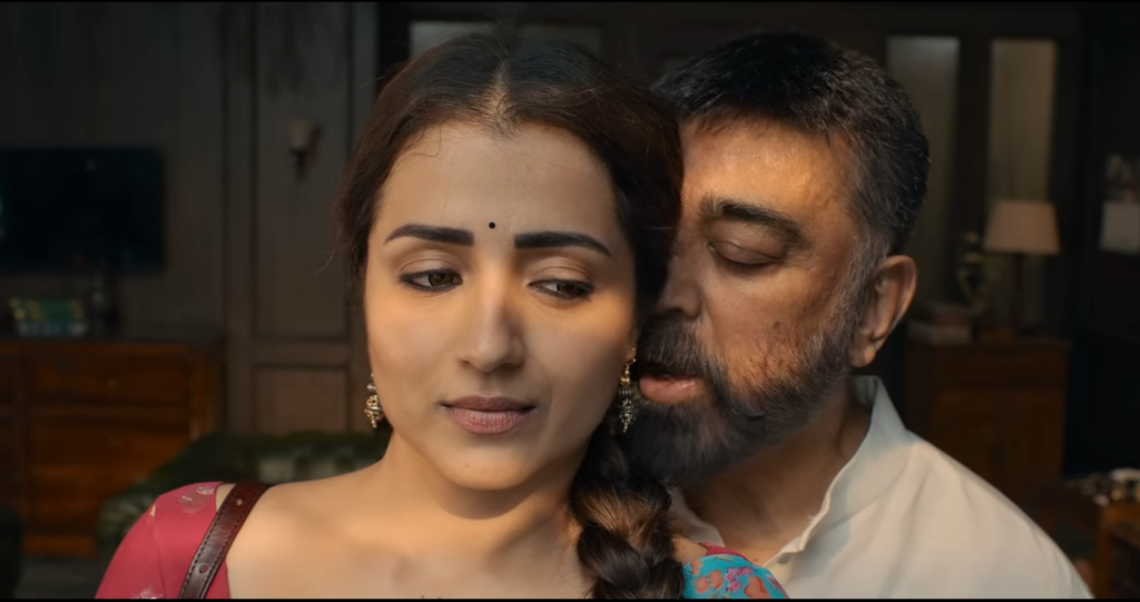 A close-up of a woman and a man sharing an intimate moment, showcasing emotions and tension in a warm-lit interior.